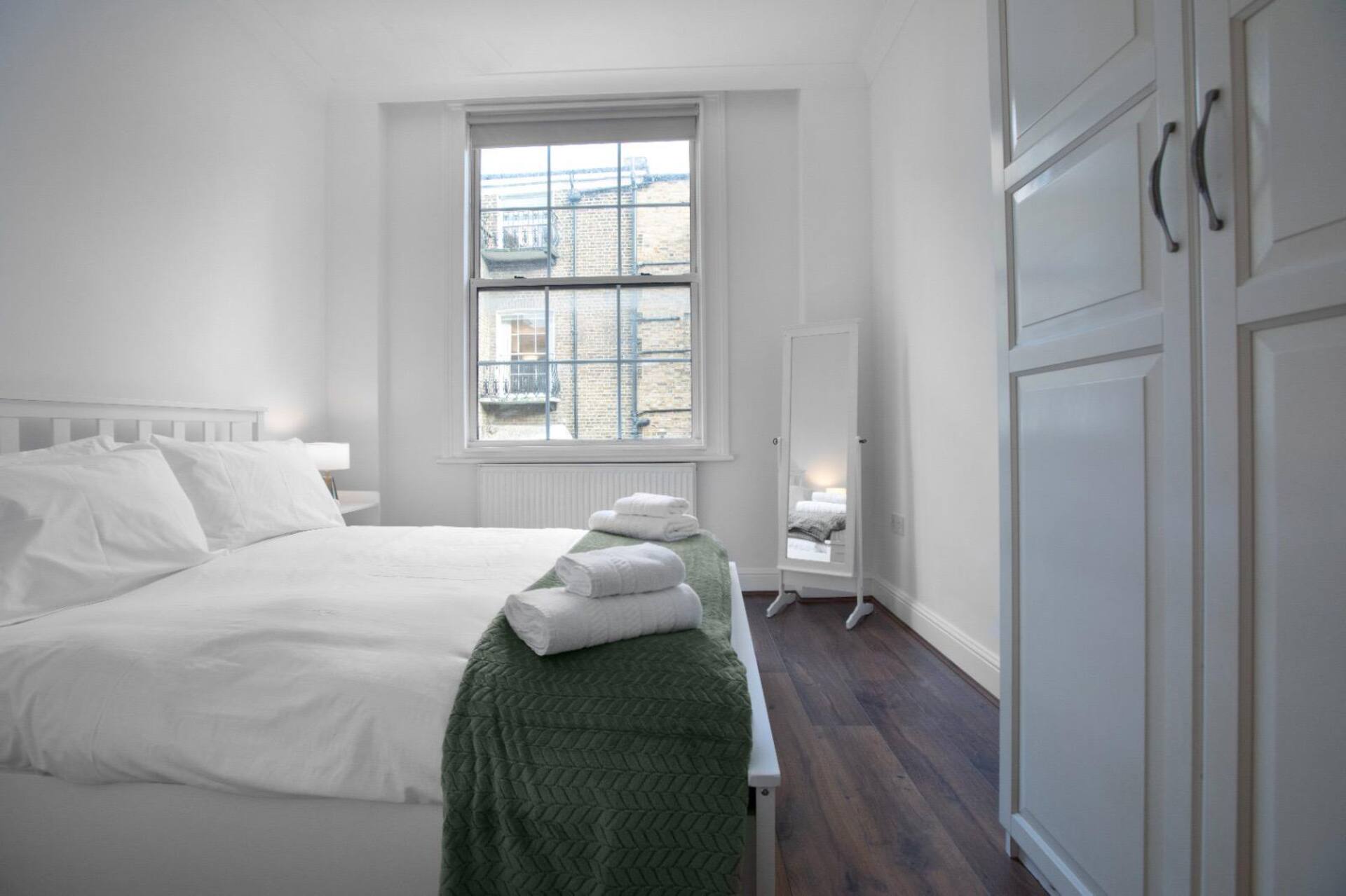 Bright bedroom with built-in wardrobe storage