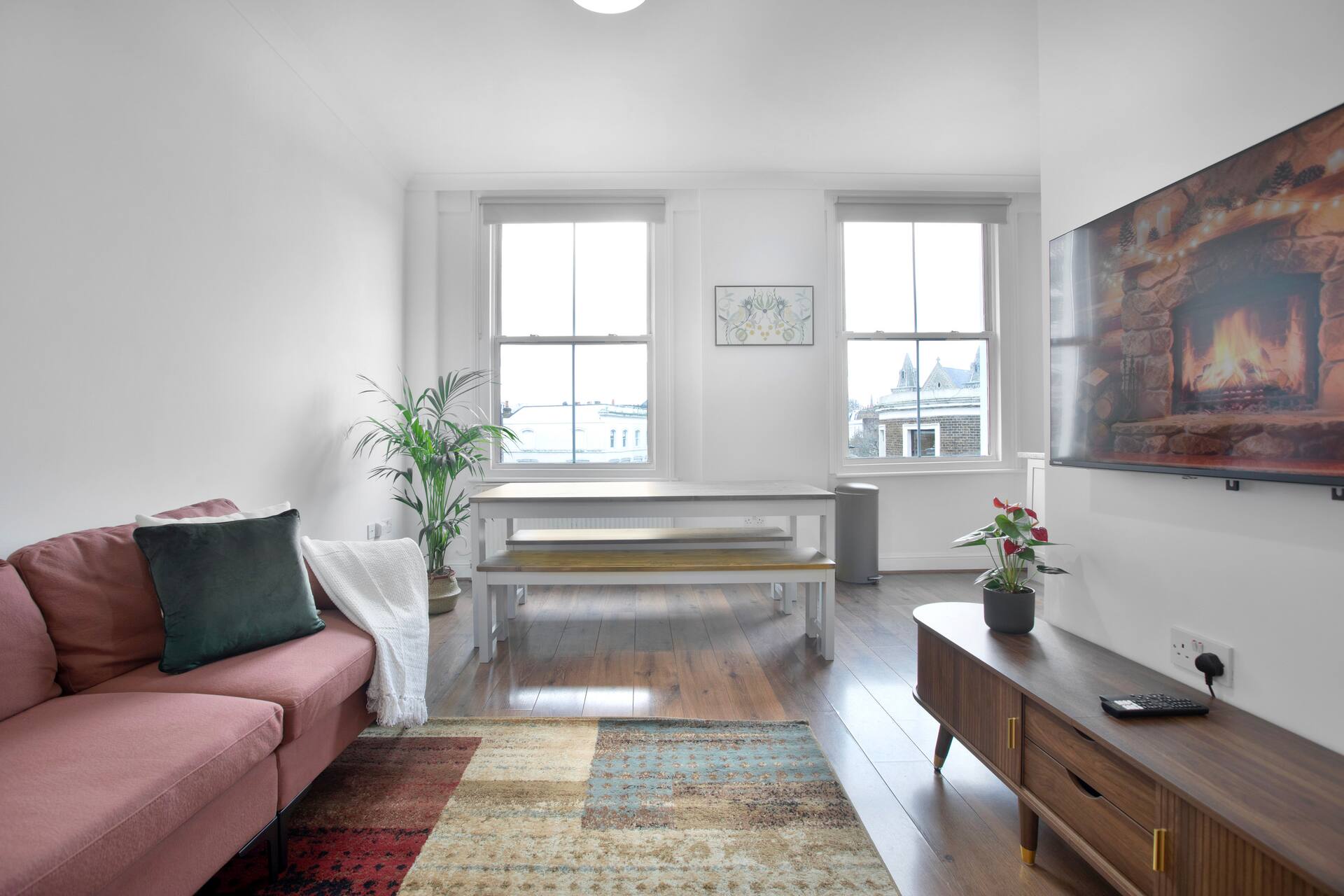 Bright living and dining area with stunning views over Notting Hill rooftops